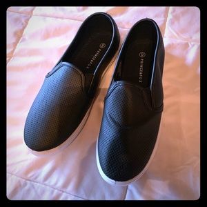 Black perforated slip on sneakers